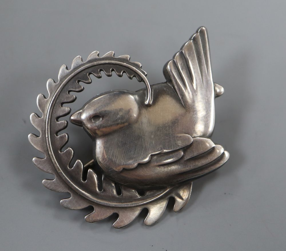 A post 1945 Georg Jensen sterling Robin on a fearn frond brooch, design no. 309 (adapted?) 49mm, gross 13 grams.